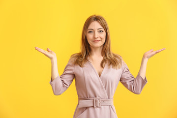 Portrait of mature woman on color background