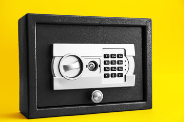Modern safe on color background