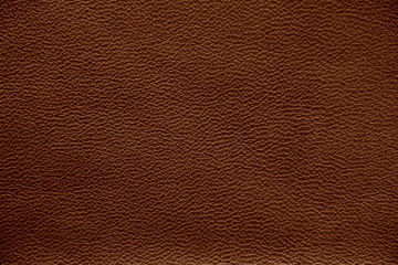 The texture of genuine leather. Impeccable and stylish background.  Beautiful stylish background. Natural skin texture close up. Brown background.  The structure of the leather material brown shades.