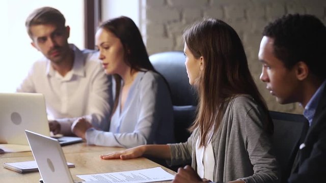 Stressed shocked diverse workers team frustrated about bad online news