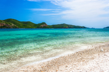 Tropical island rock on the beach with blue sky. Koh kham pattaya thailand.