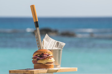 hamburger with turquoise sea background