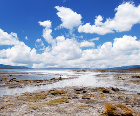 Fototapeta na wymiar Sunshine surface covered with steam and geysers in Bolivia