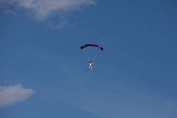 Skydive, people in the sky, under clouds