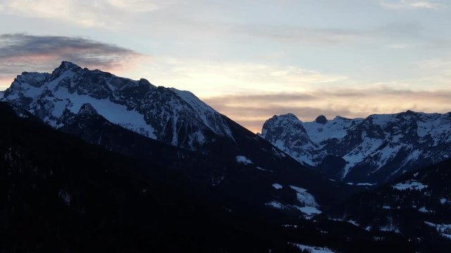 Sunset with the view on huge mountain range, aerial shot in 4k