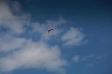 Skydive, people in the sky, under clouds