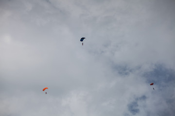 Skydive, people in the sky, under clouds