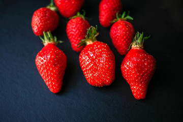 Group of delicious strawberrys on black background