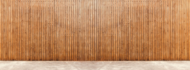 Wood wall with concrete floor.