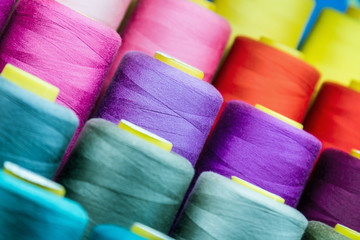 different colors of thread, textile, for clothing manufacture or in the shop