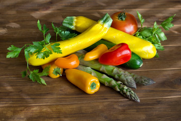 Fresh summer vegetables on a brown wood