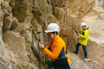 geologists against the rocks in the canyon