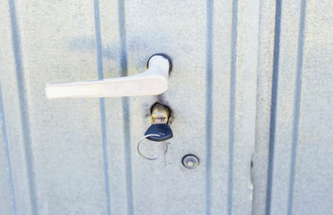 Door handle and built-in lock, with key, on iron door