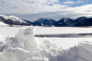 Fototapeta na wymiar mountain landscape with snow and iced lake