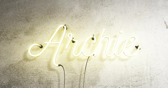 Realistic neon sign that says the name Archie, the neon sign zooms in then it has flickering effects on the neon tubes.
