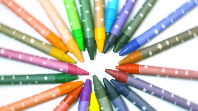 Colorful pencils point to centre and form bright circle, creativity, imagination, art, sharp ends, stationery. Close up, seamless loop, 4K Ultra HD.