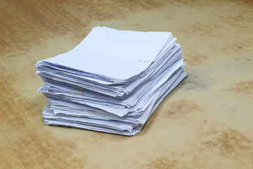 stack pile of paper on wood table background