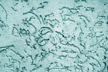 Old wall texture as background in cyan color.