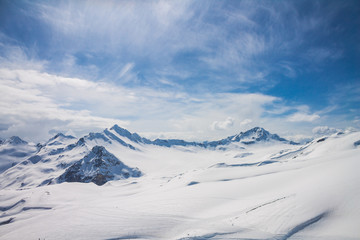 Fototapeta na wymiar Snowy peaks on Elbrus, Russia.