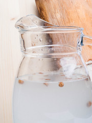 Spring useful vitamin drink. Fresh cold birch juice in a jug with raisins Concept of healthy and vitamin food