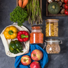 Reusable, eco-friendly packing of groceries, organic food in cotton bags and glass jars, zero waste shopping, sustainable living, plasticfree