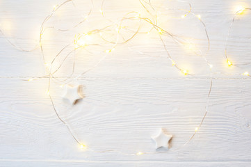 Mockup Christmas white beige bow, gold gift box and cone. Flat lay on a white wooden background, with place for your text. Top view