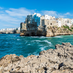 Rough sea on the coast of Puglia. Enchantment of Polignano a Mare. Italy