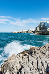 Rough sea on the coast of Puglia. Enchantment of Polignano a Mare. Italy
