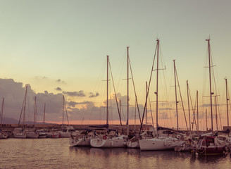 Fototapeta na wymiar calm harbor scene. boats against sunset. vintage