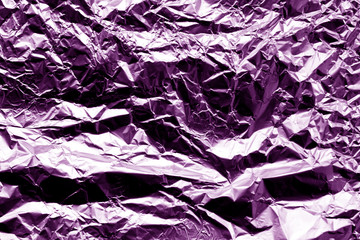 Metal foil texture in purple color.