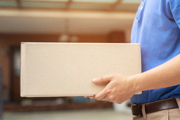 parcel delivery man of a package through a service send to home. consign hand Submission customer accepting a delivery of boxes from delivery man. 