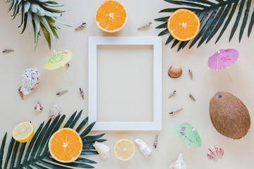 Exotic fruits with blank frame on table