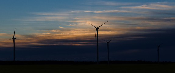 Fototapeta na wymiar WIND TURBINE - Sunrise over a wind farm