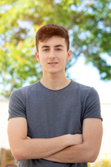 Obraz premium Attractive teenager guy in a park