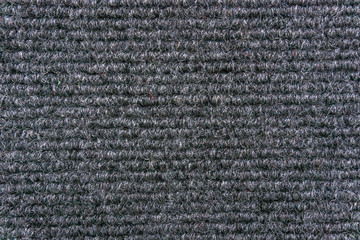Synthetic fiber carpet
