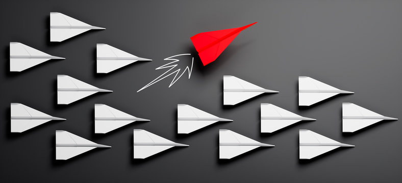 Gruppe weißer Papierflieger mit rotem Leader 2