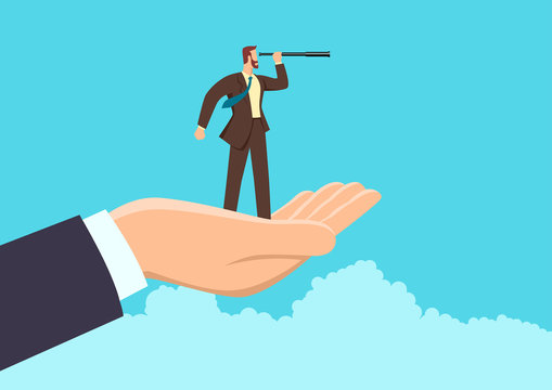 Hand holding a businessman using telescope