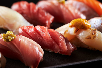 Japanese luxury assorted sushi on black background 