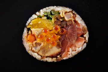 Japanese sushi roll on black background 