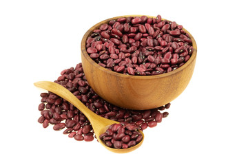 Red beans in a wooden dishes with a spoon isolated on white background