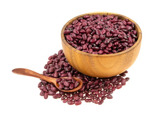 Red beans in a wooden dishes with a spoon isolated on white background