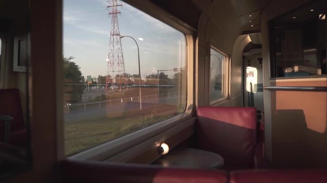 Static shot from inside of a train showing the city passing by though the windows and also the trainteriors in Canada.
