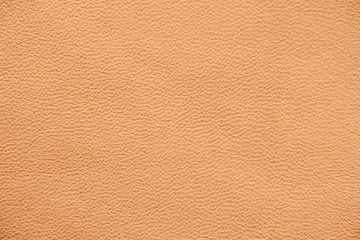 The texture of genuine leather. Impeccable and stylish background. Beautiful stylish background. Natural skin texture close up. Brown background.  The structure of the leather material brown shades.