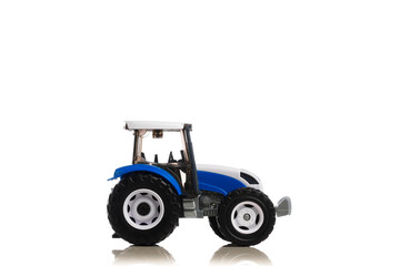 farm tractor toy, isolated on white