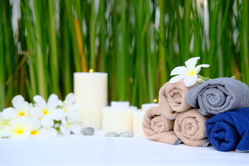 spa setting aromatherapy candles in natural bokeh background