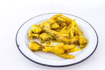 Deep fried chicken feet is a traditional South African township food snack image with copy space
