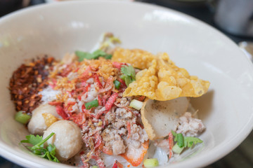 Noodle tom yum with pork and egg .