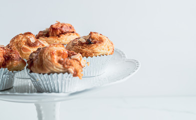 Croissant Butter with custard on the table. freshly baked croissants on white modren background with copy space for you design and text