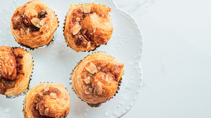 Croissant Butter with custard on the table. freshly baked croissants on white modren background with copy space for you design and text