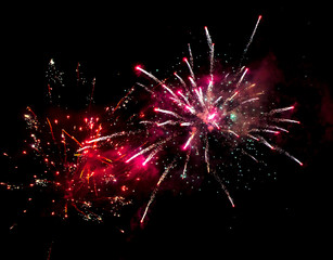 Fototapeta na wymiar Beautiful sparks from fireworks in the sky at night